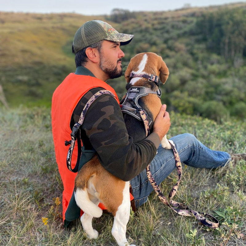 Load image into Gallery viewer, man sitting in a field holding a beagle in nosehill park, calgary, ab
