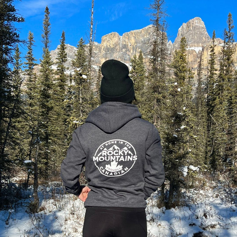 Load image into Gallery viewer, Female wearing a hoodie sunny day in banff alberta
